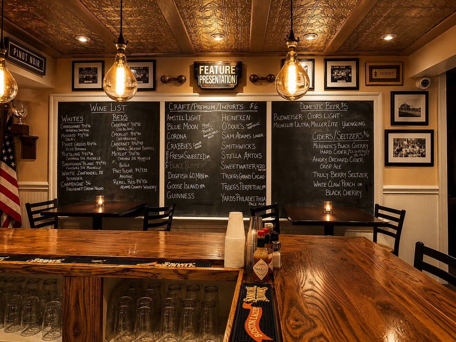A bar with a chalkboard menu and a flag in the background