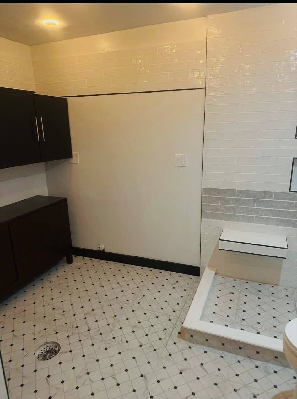 Bathroom remodel with white tile and shower