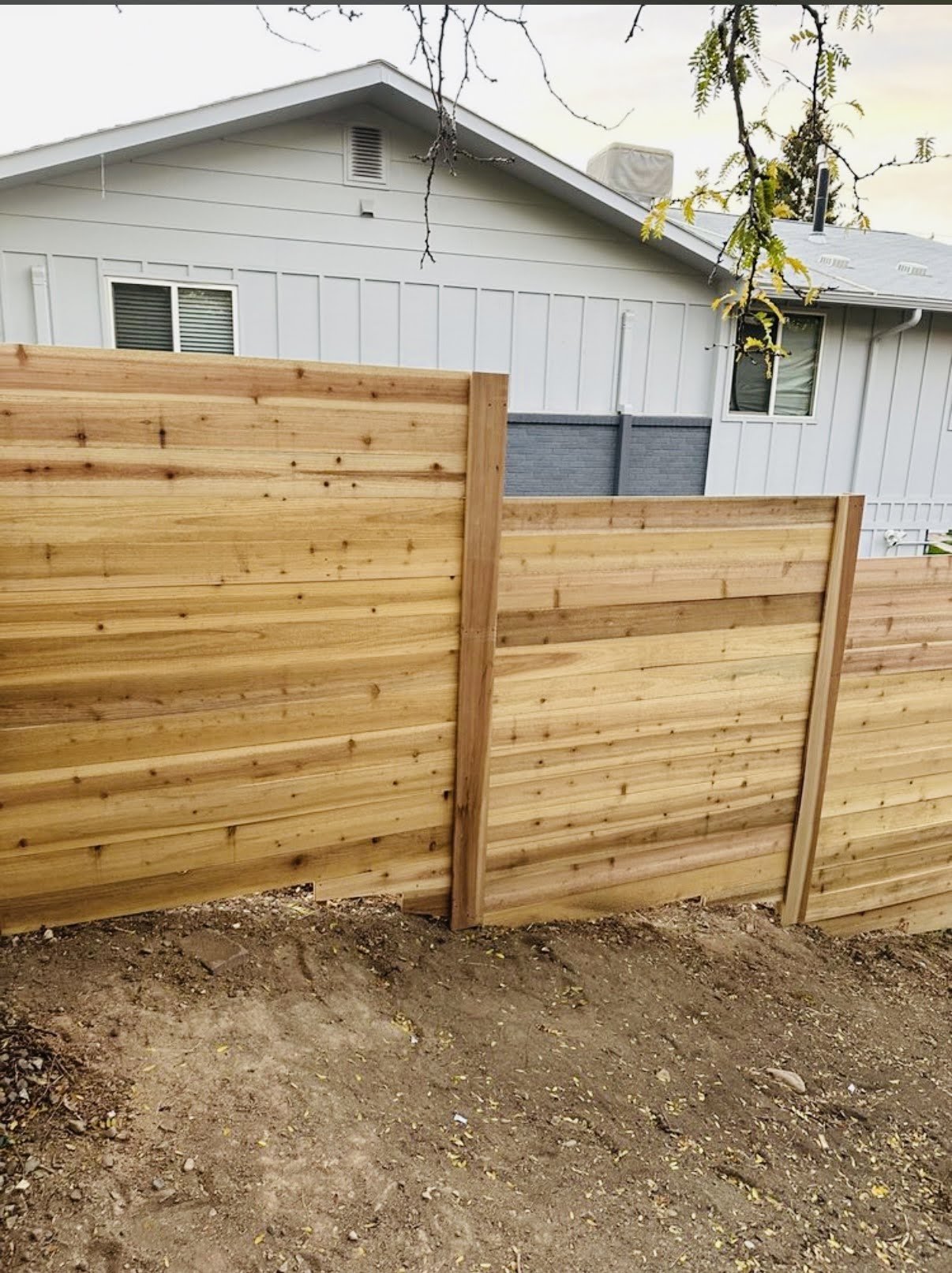 Wooden fence with gate installation