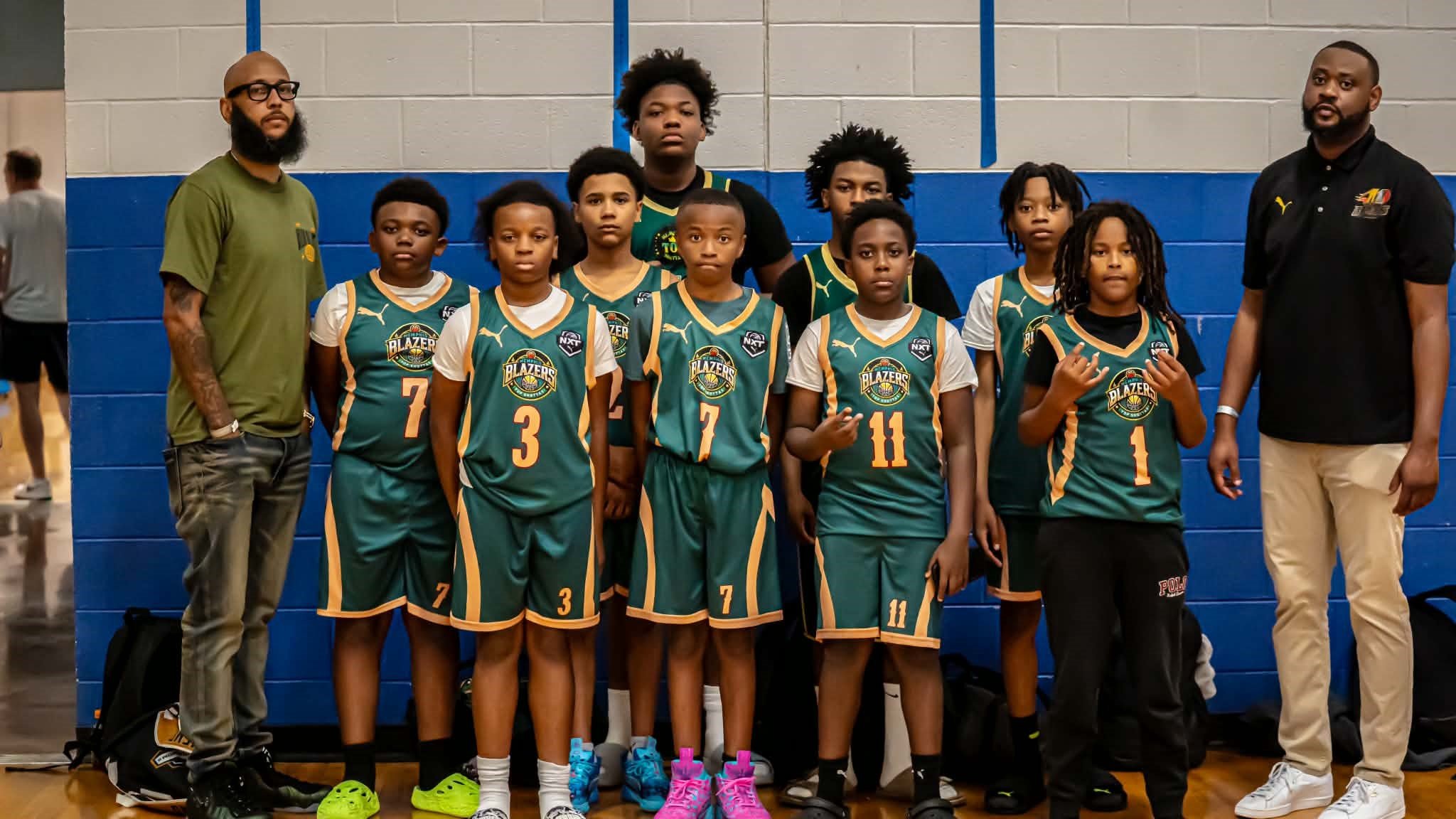 13U basketball team with Coach Evan and Coach Williams posing for a group photo