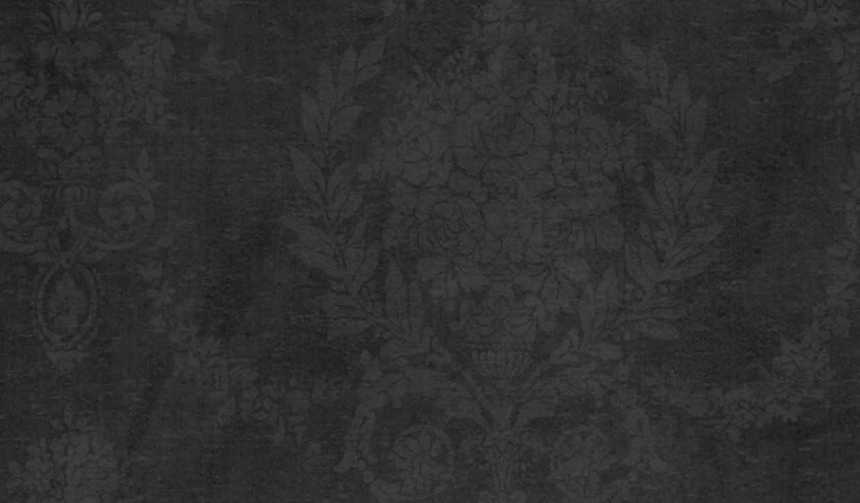 A black and white wallpaper with a floral pattern and intricate designs
