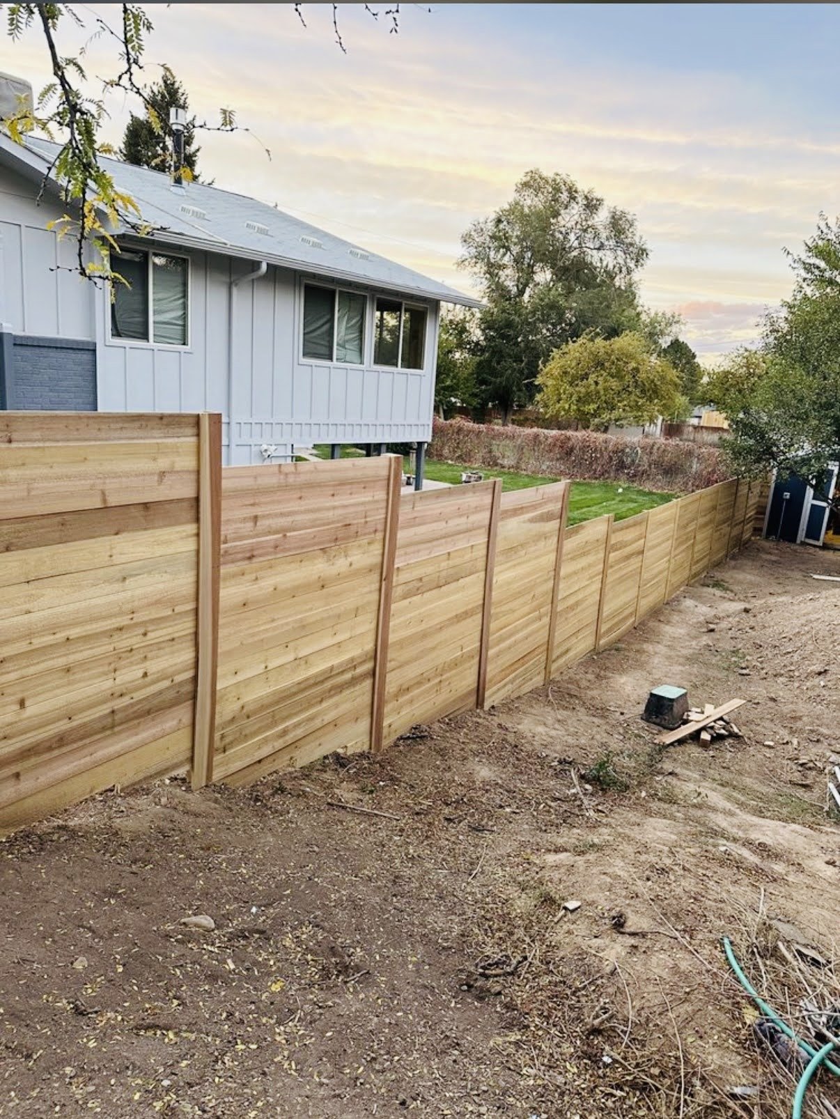 Wood fence construction in backyard