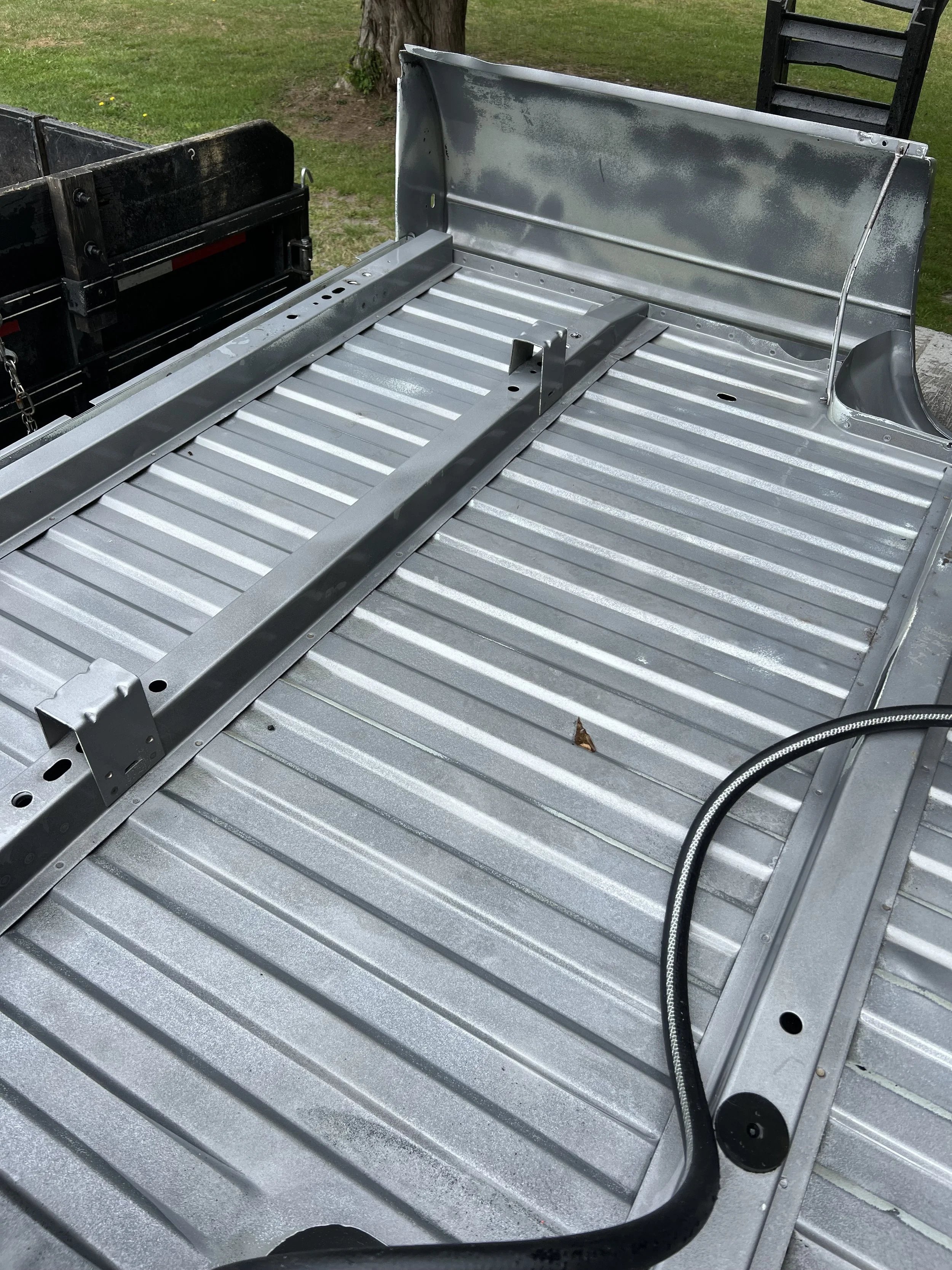 A metallic truck bed after blasting