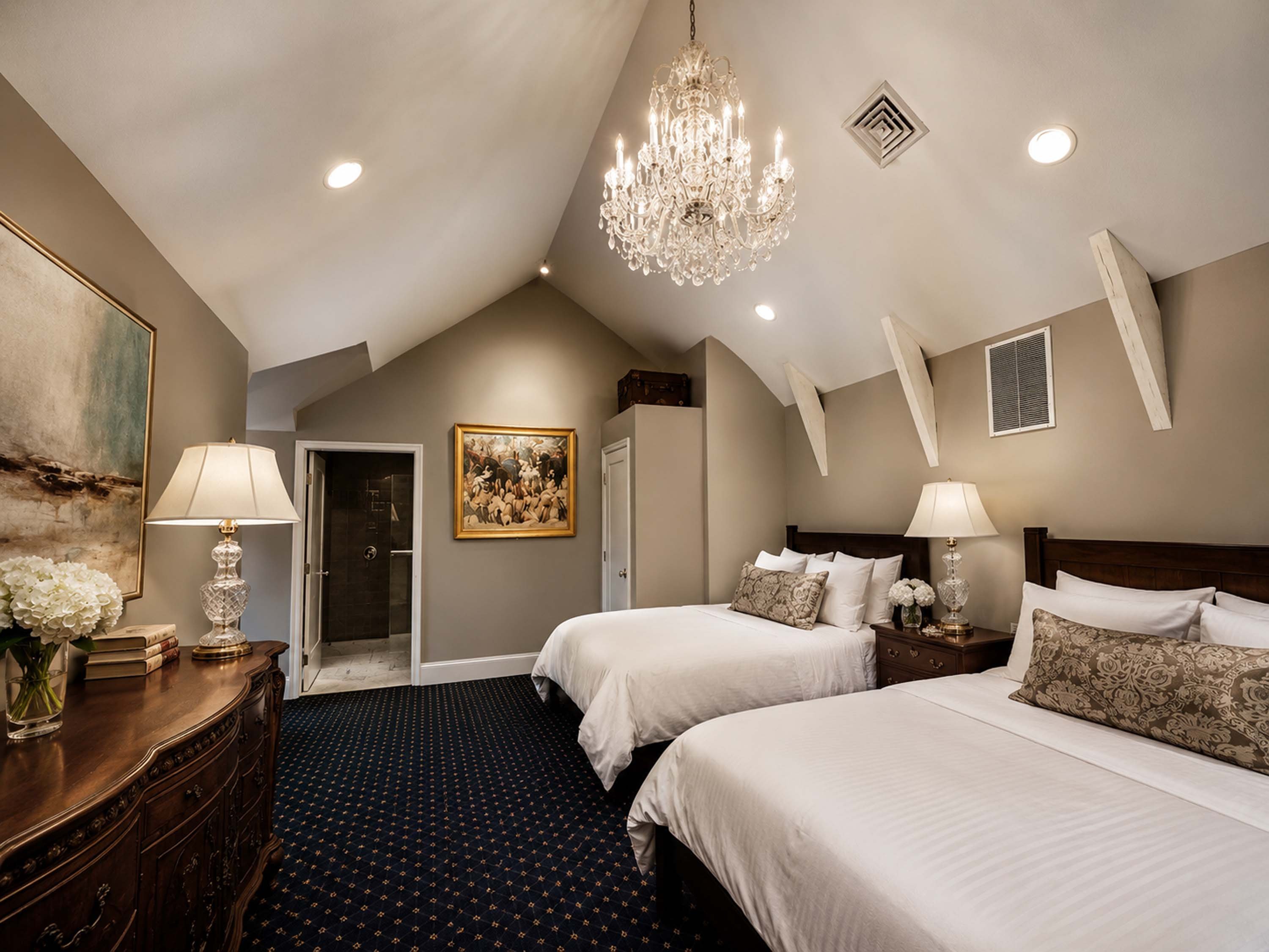 A luxurious bedroom with two beds, a chandelier, and a painting on the wall.